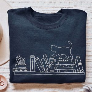 book sweatshirt embroidered sweater for cat lovers cat on bookshelf cozy reading sweatshirt book club bookworm bookish merch cat sweatshirt 2.jpeg