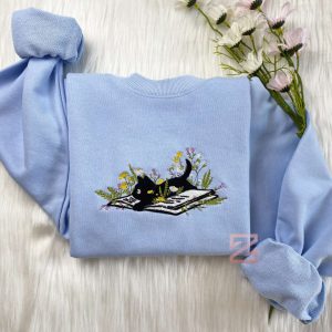 cute cat lying on book with flower embroidered sweatshirt flower with cat embroidered hoodie book lover sweater crew neck sweatshirt 1.jpeg