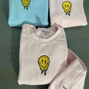 smiley face embroidered sweatshirt melted smiley face crewneck 2.jpeg